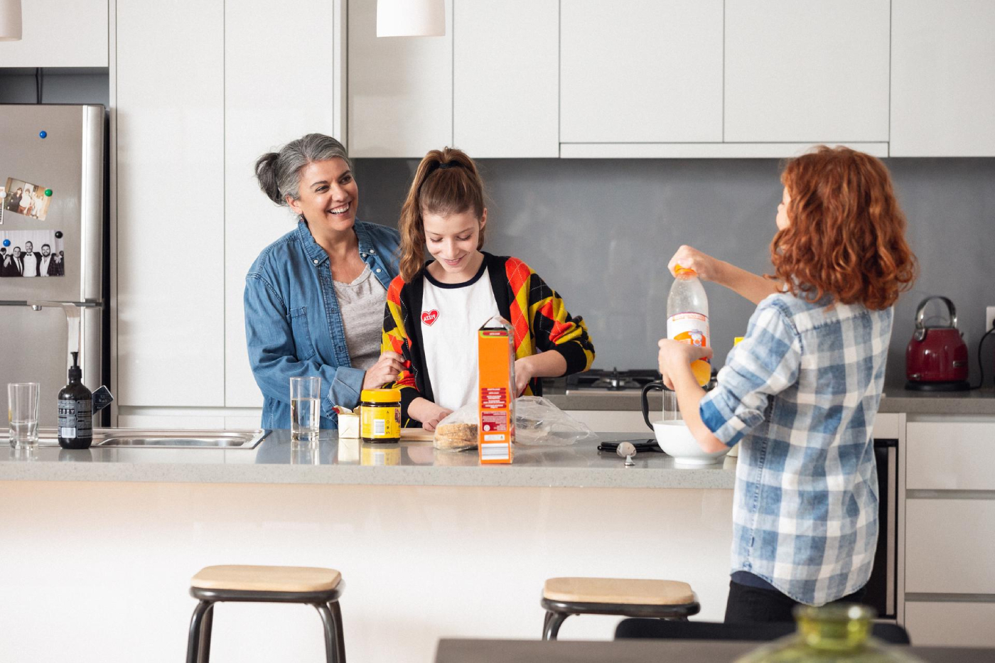 Family making breakfast in the kitchen