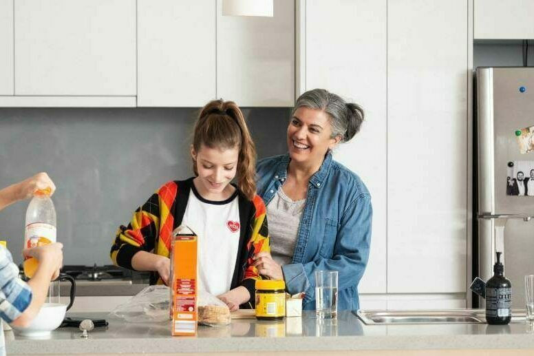 Grandma with grand children in the kitchen