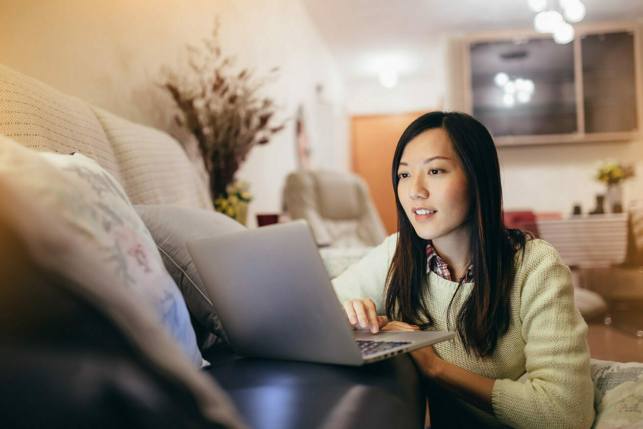 Woman at home on her laptop