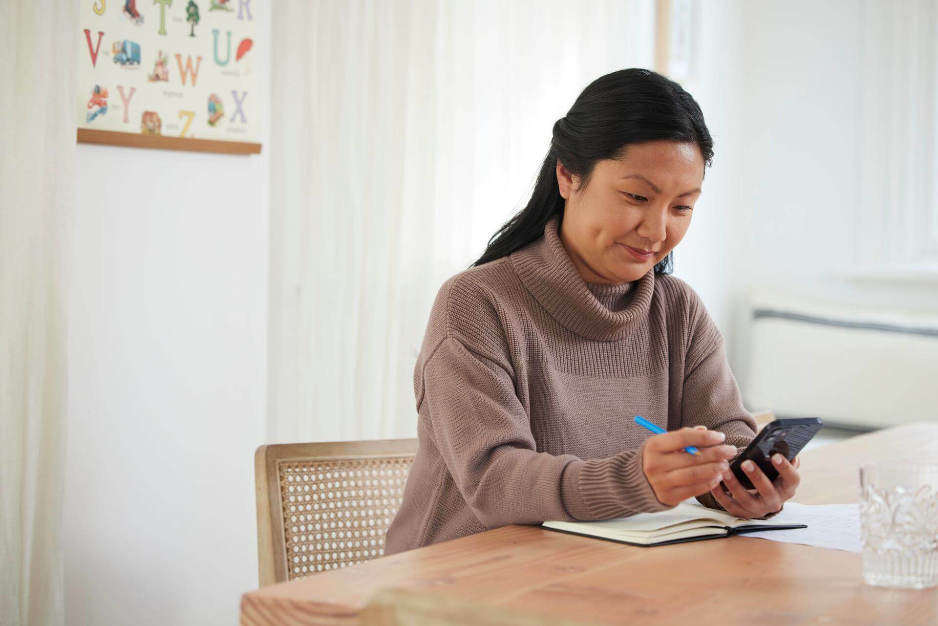 Woman on her phone at home