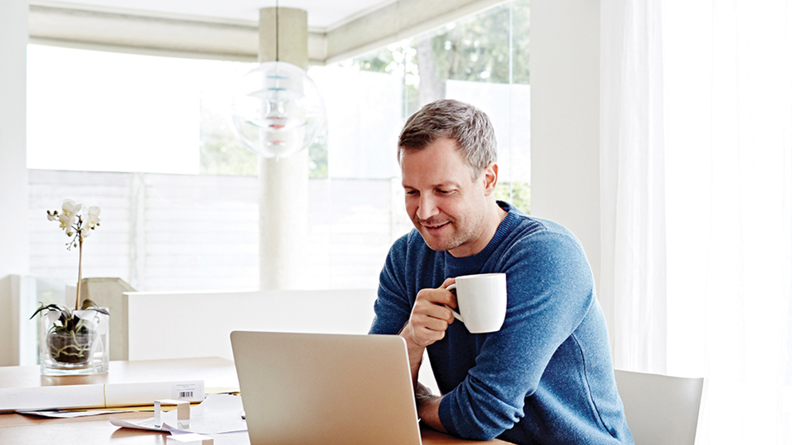 Man on laptop racv